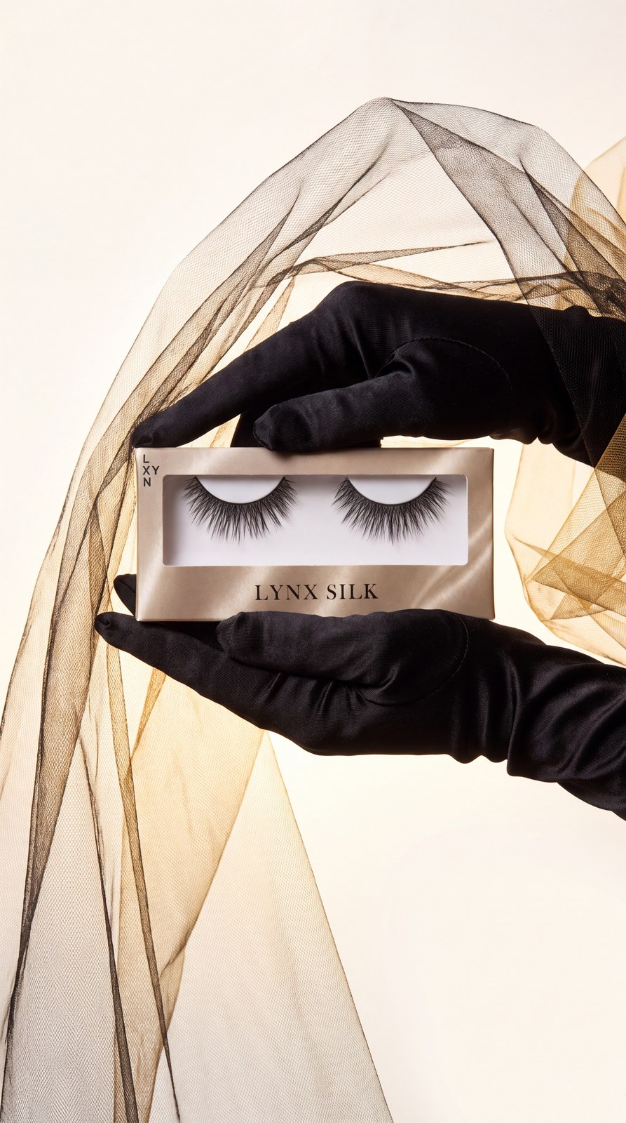 LYNX SILK Packaging held by black satin gloves